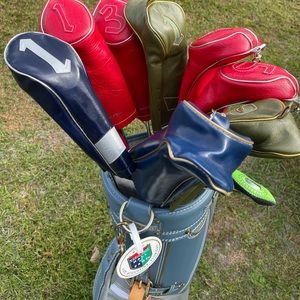 Antique title list golf bag with miscellaneous clubs